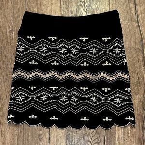 HARPER black midi skirt with pastel pattern/detailing.